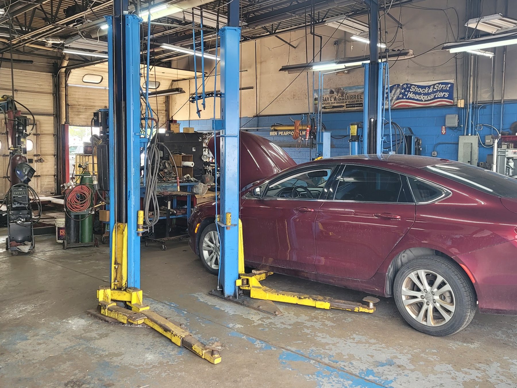 Car on the lift in the service bays
